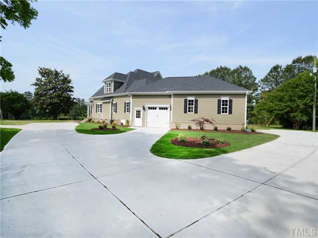 651 Friendship Church Road Middlesex, NC 27557 - Photo 3 of 25 Lots of Concrete w/one car for In Law Suite & 2 Car Garage on Rear for Main Home Parking Lot/Garage