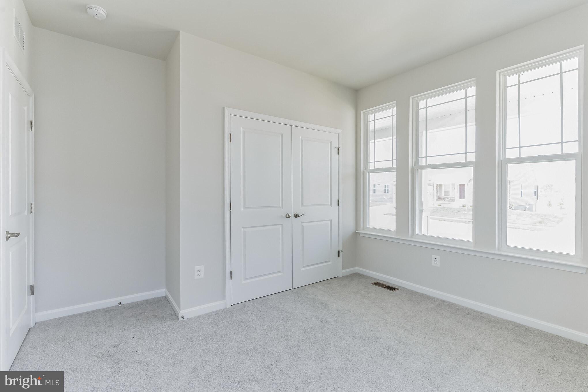 19 Golden Raintree Court Middletown, DE 19709 - Photo 14 of 30 an empty room with windows