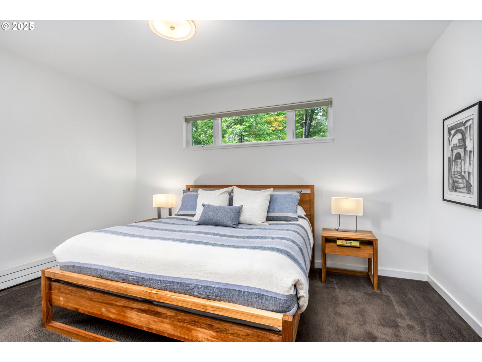 10190 Pine Ridge Drive Nehalem, OR 97131 - Photo 16 of 35 a bedroom with a bed and a window