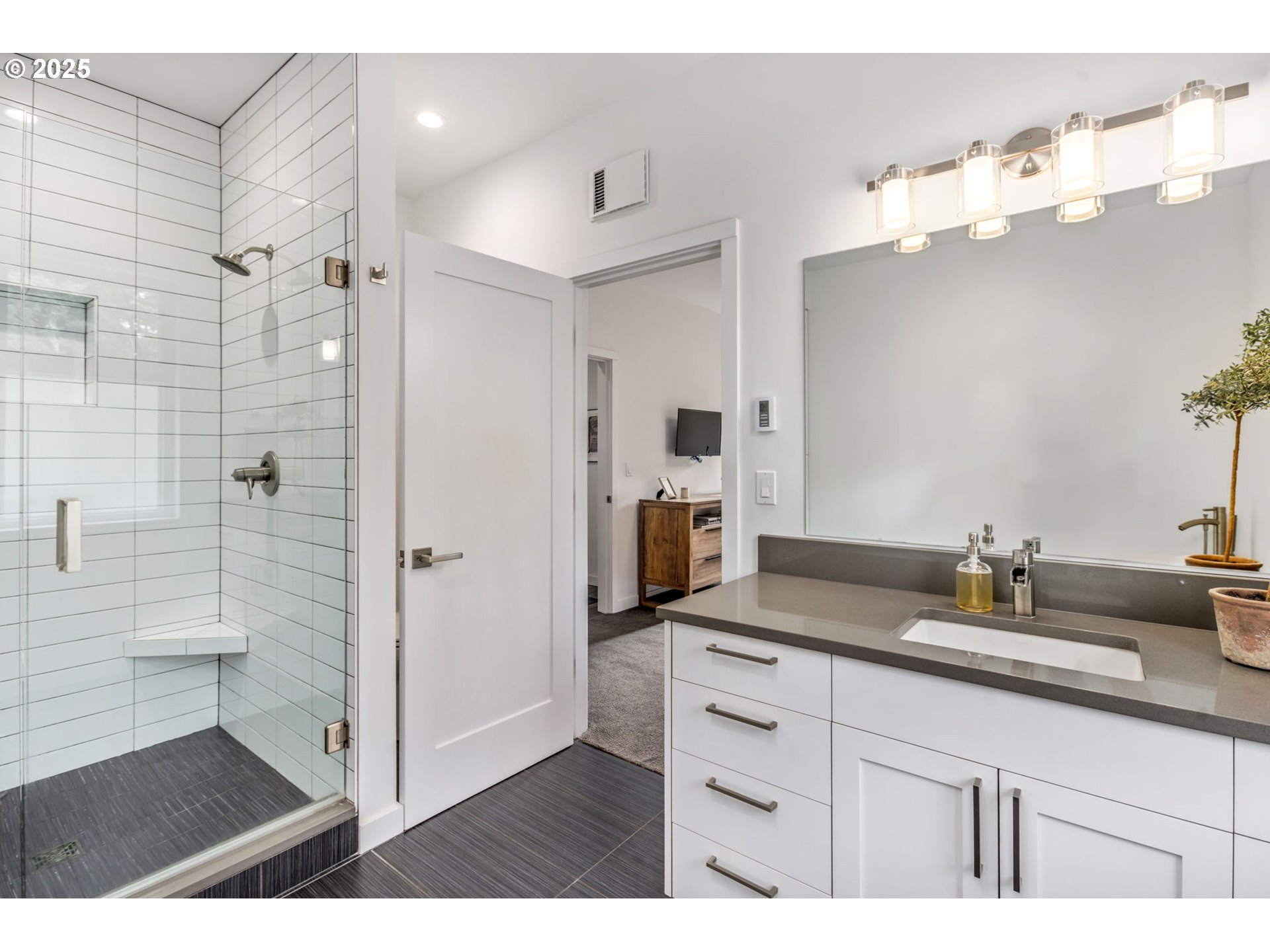10190 Pine Ridge Drive Nehalem, OR 97131 - Photo 17 of 35 a bathroom with a sink double vanity and a mirror