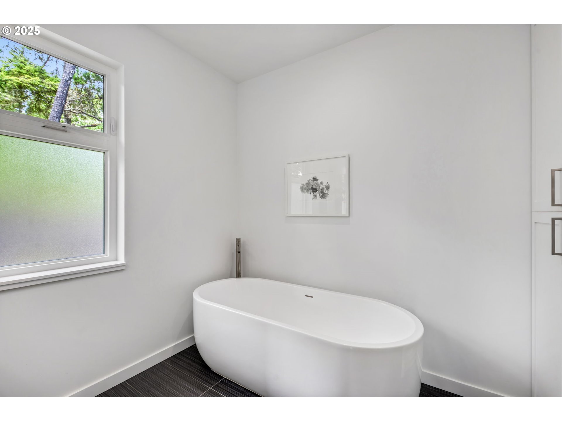 10190 Pine Ridge Drive Nehalem, OR 97131 - Photo 18 of 35 a bathroom with a toilet a sink and a window
