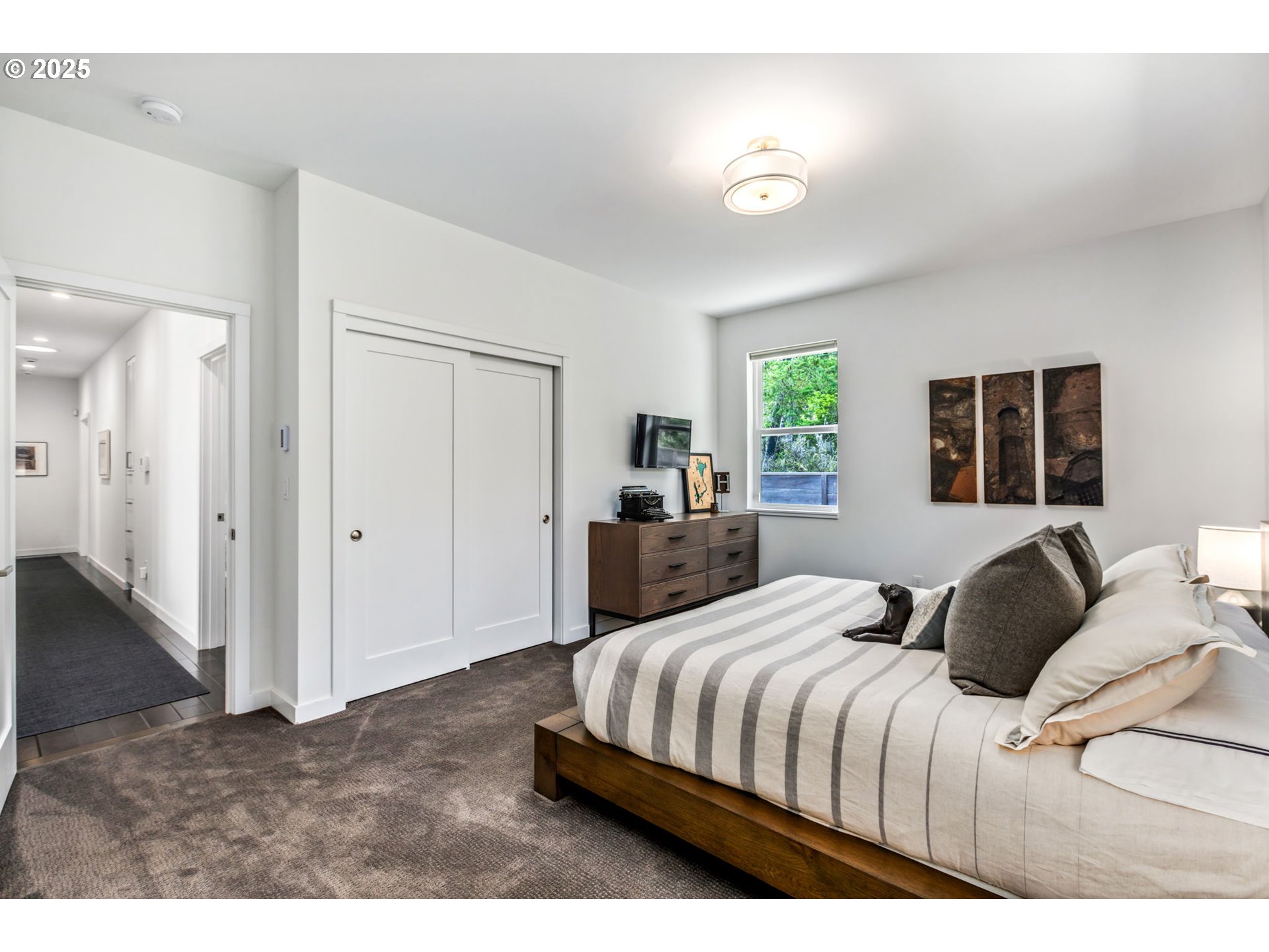 10190 Pine Ridge Drive Nehalem, OR 97131 - Photo 20 of 35 a bedroom with a bed and a couch