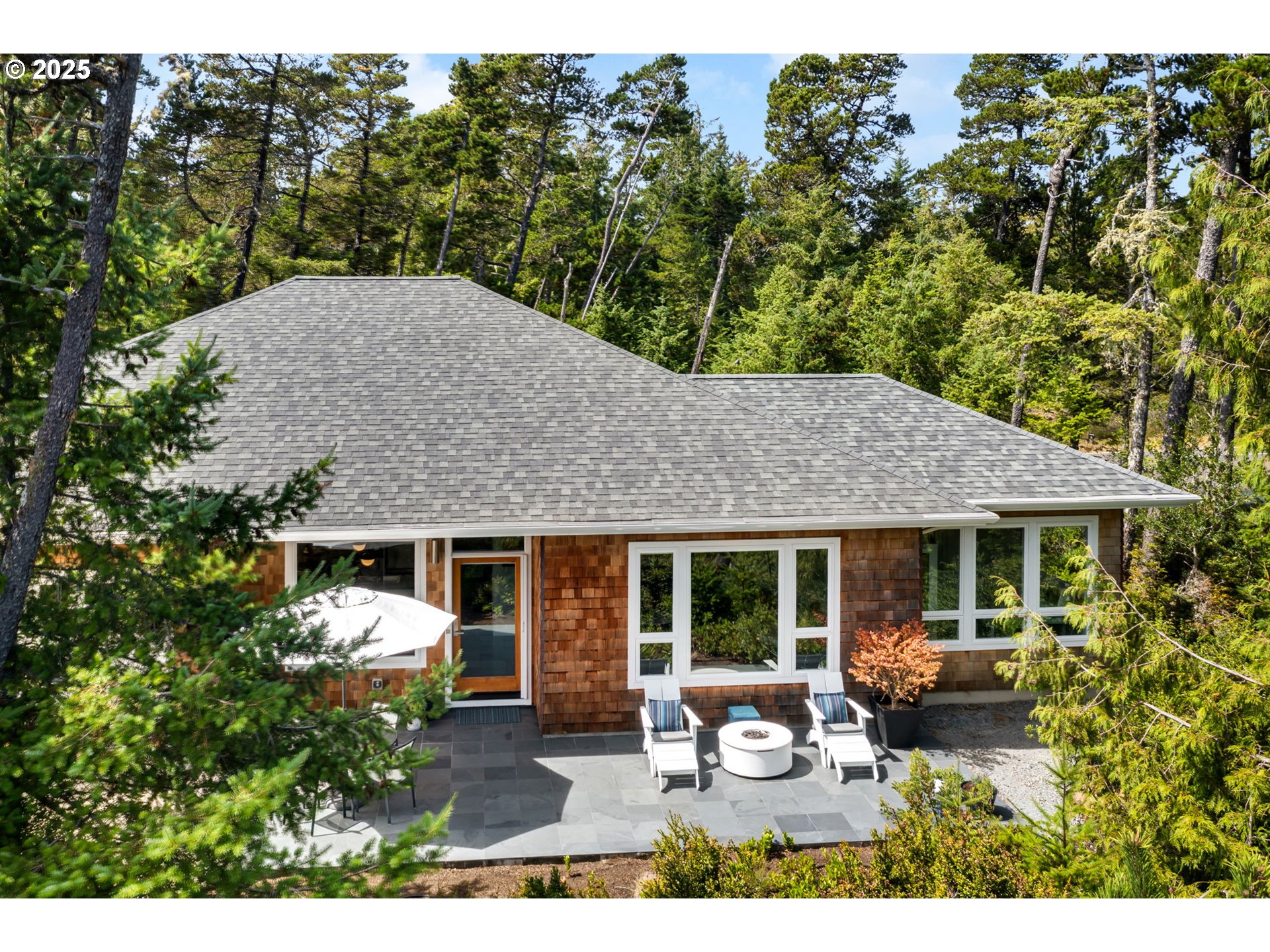 10190 Pine Ridge Drive Nehalem, OR 97131 - Photo 2 of 35 a view of a house with patio