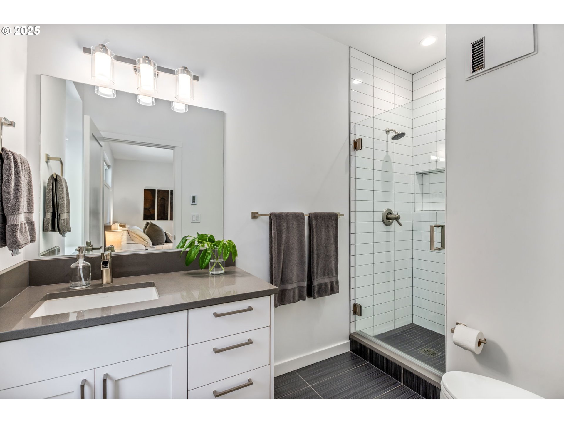 10190 Pine Ridge Drive Nehalem, OR 97131 - Photo 21 of 35 a bathroom with a double vanity sink mirror and shower