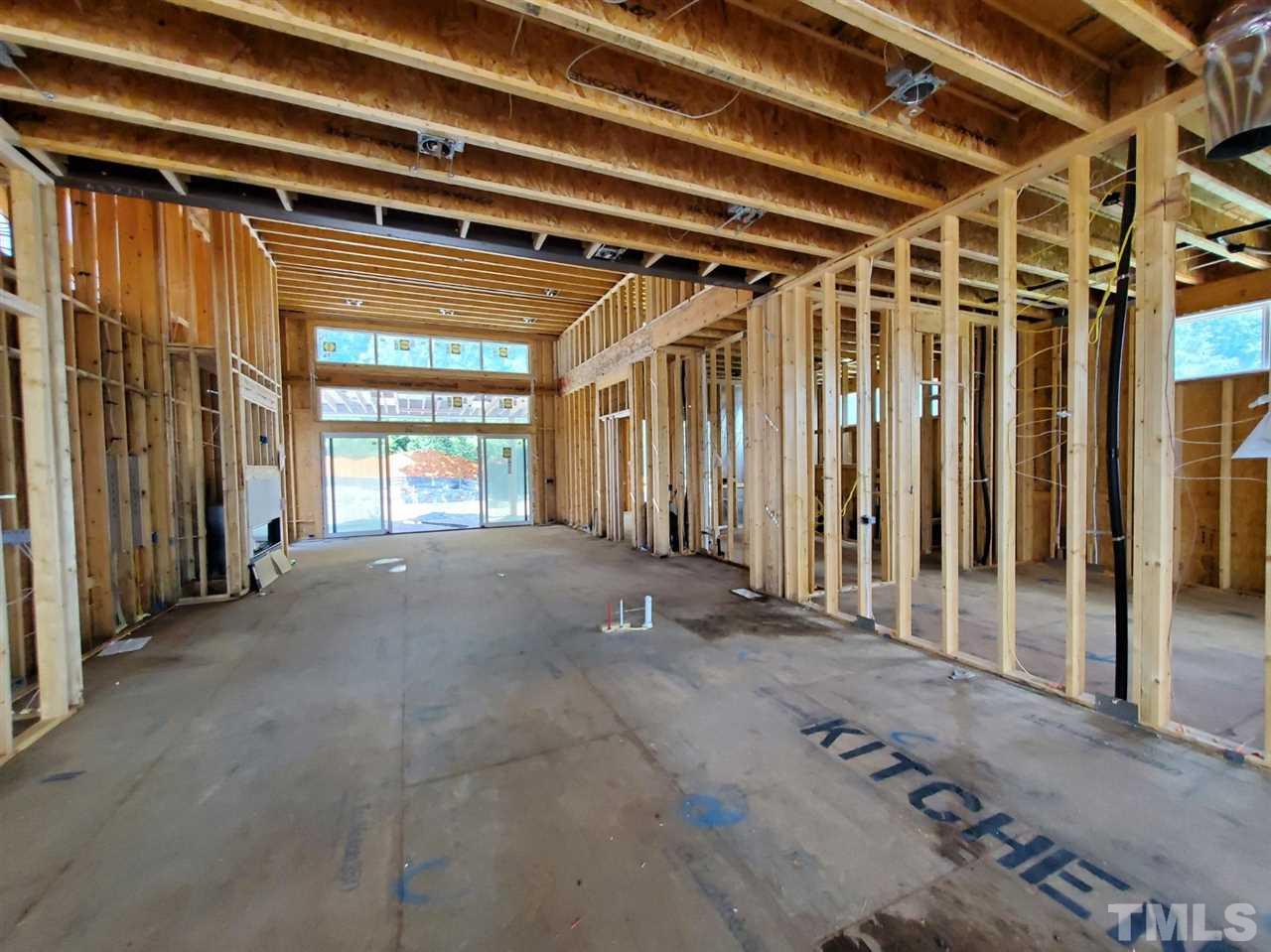 109 Dartmouth Road Raleigh, NC 27609 - Photo 15 of 24 a view of an empty room with wooden walls
