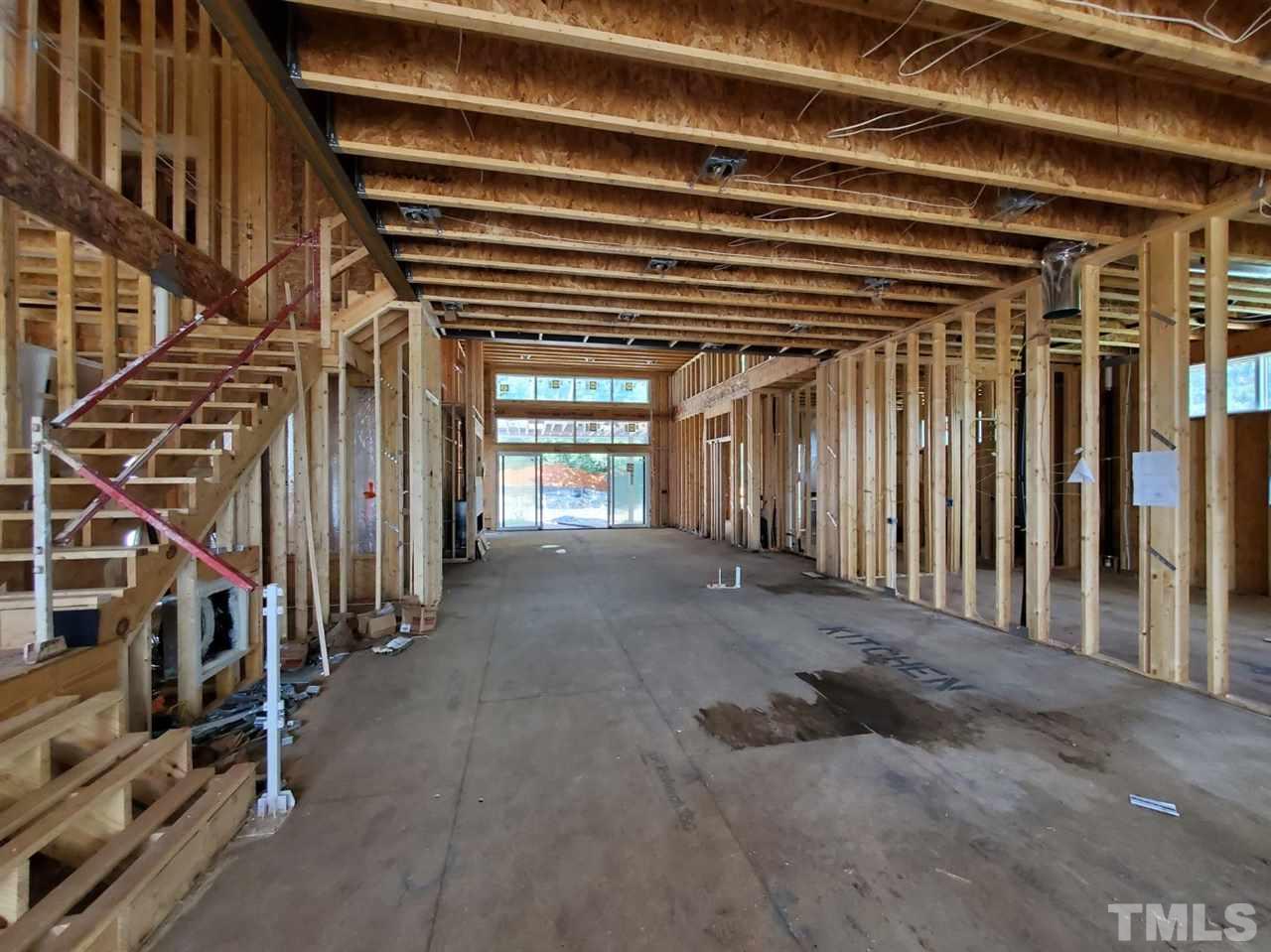 109 Dartmouth Road Raleigh, NC 27609 - Photo 16 of 24 a view of an empty room with stairs