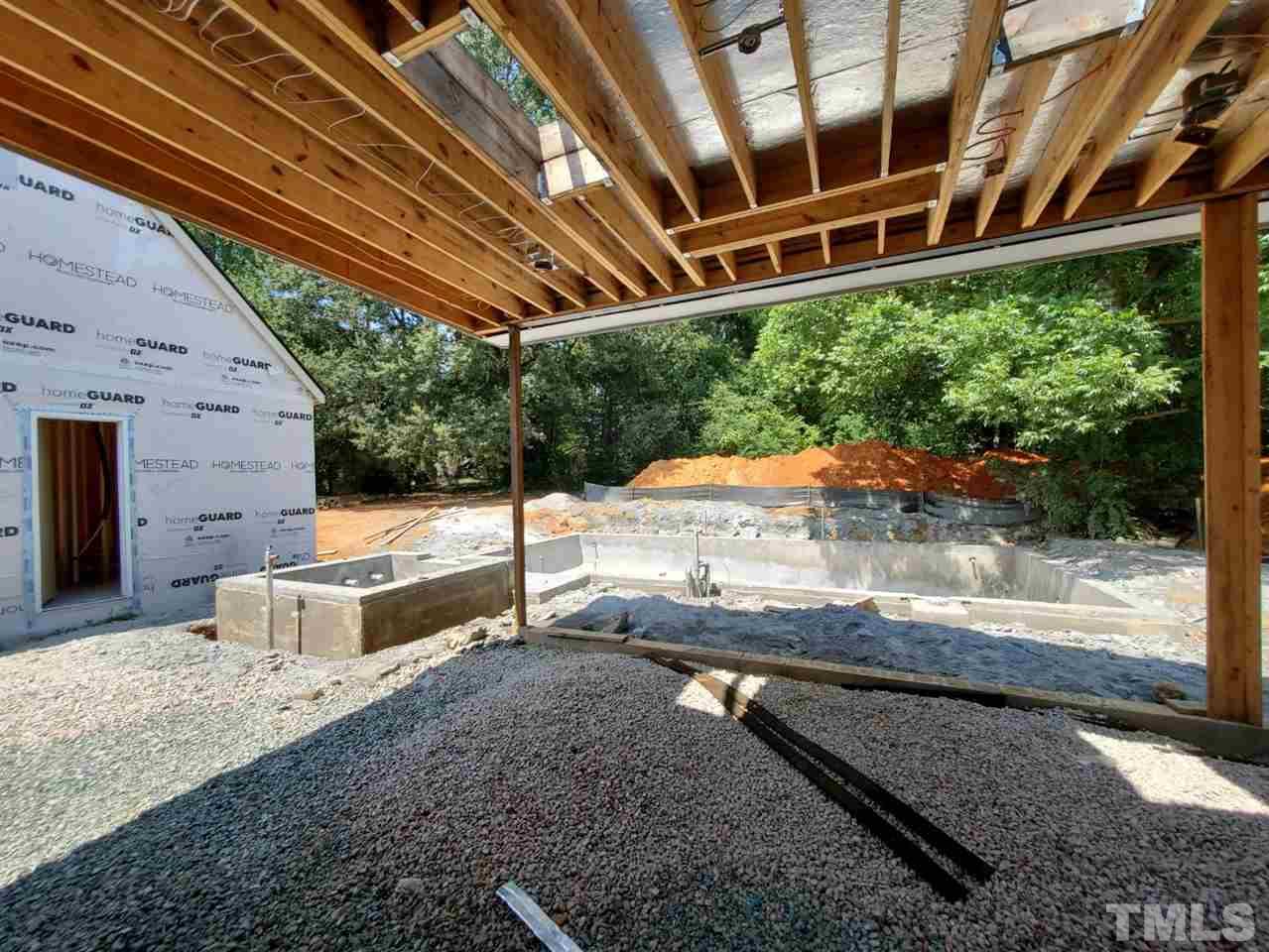 109 Dartmouth Road Raleigh, NC 27609 - Photo 20 of 24 a view of a backyard with a sitting area