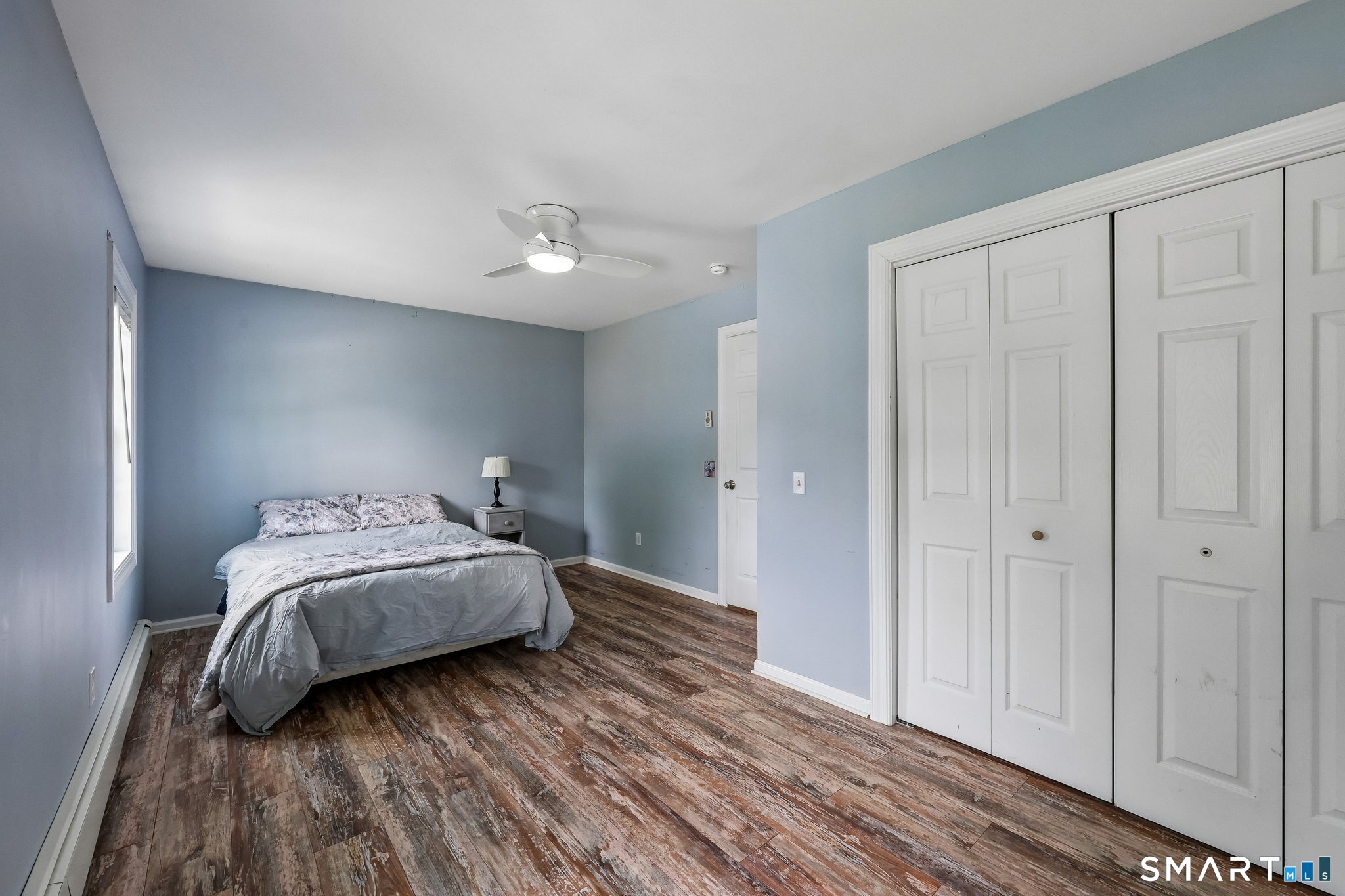 21 Friendly Road Norwalk, CT 06851 - Photo 14 of 28 Another spacious bedroom with an oversized closet and a laundry chute that goes directly to the laundry room on main level! Double windows allow the morning sunlight to come through! Freshly painted with hardwood flooring throughout!
