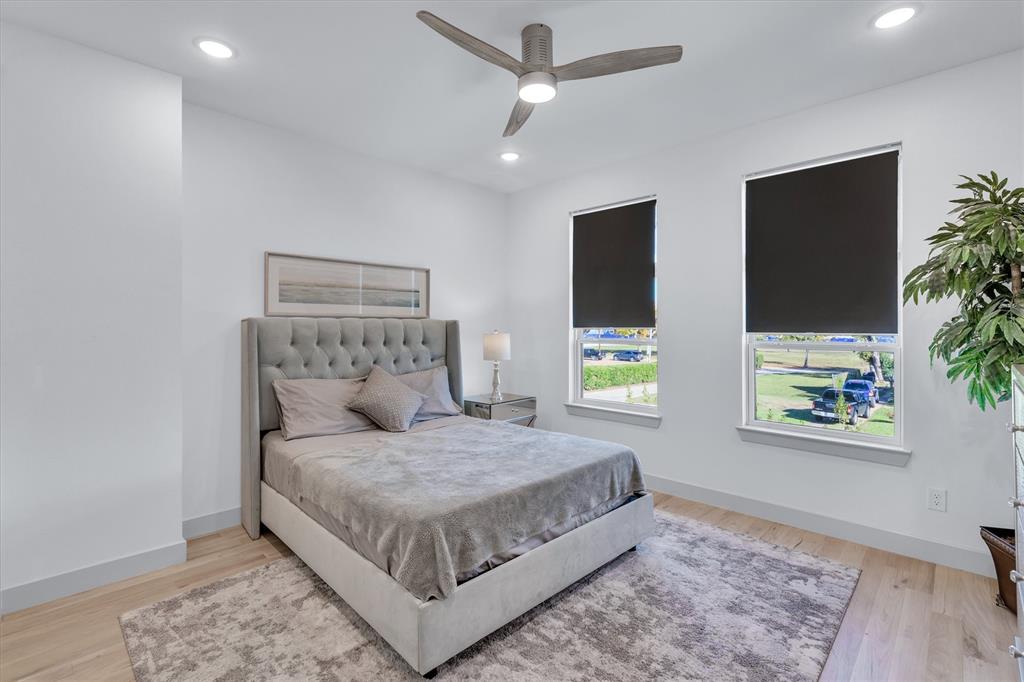 7519 Robin Road Dallas, TX 75209 - Photo 13 of 40 a bedroom with a large bed and a window