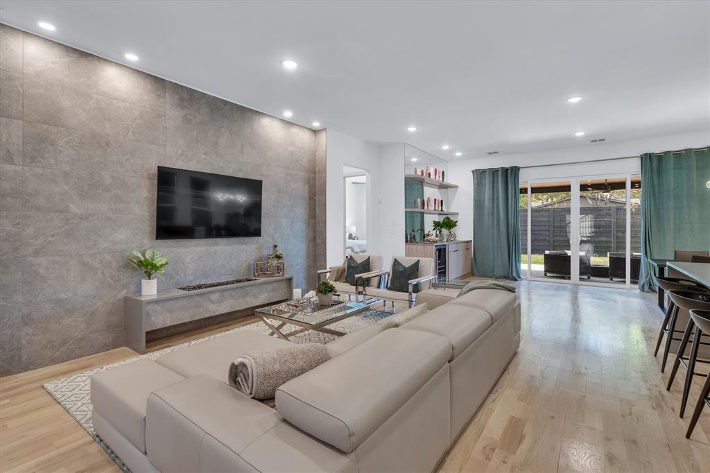 7519 Robin Road Dallas, TX 75209 - Photo 17 of 40 a living room with furniture and a flat screen tv