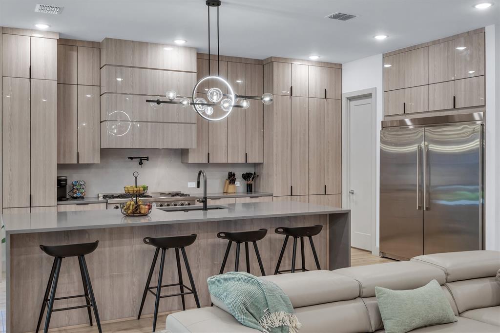 7519 Robin Road Dallas, TX 75209 - Photo 39 of 40 a kitchen with stainless steel appliances granite countertop a sink a refrigerator and a stove
