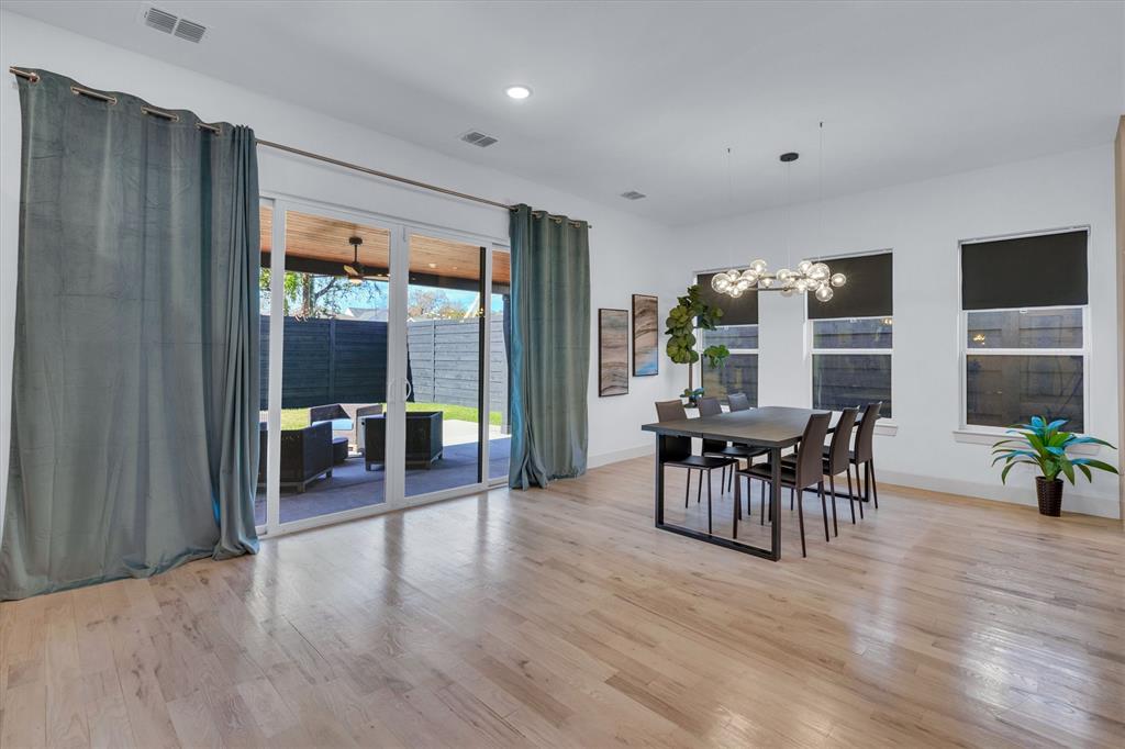 7519 Robin Road Dallas, TX 75209 - Photo 24 of 40 a dining room with furniture window and wooden floor
