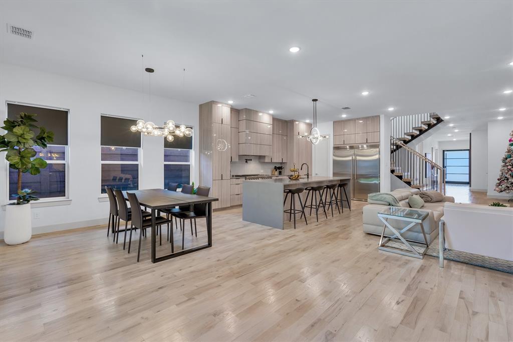 7519 Robin Road Dallas, TX 75209 - Photo 25 of 40 a dining room with furniture and wooden floor