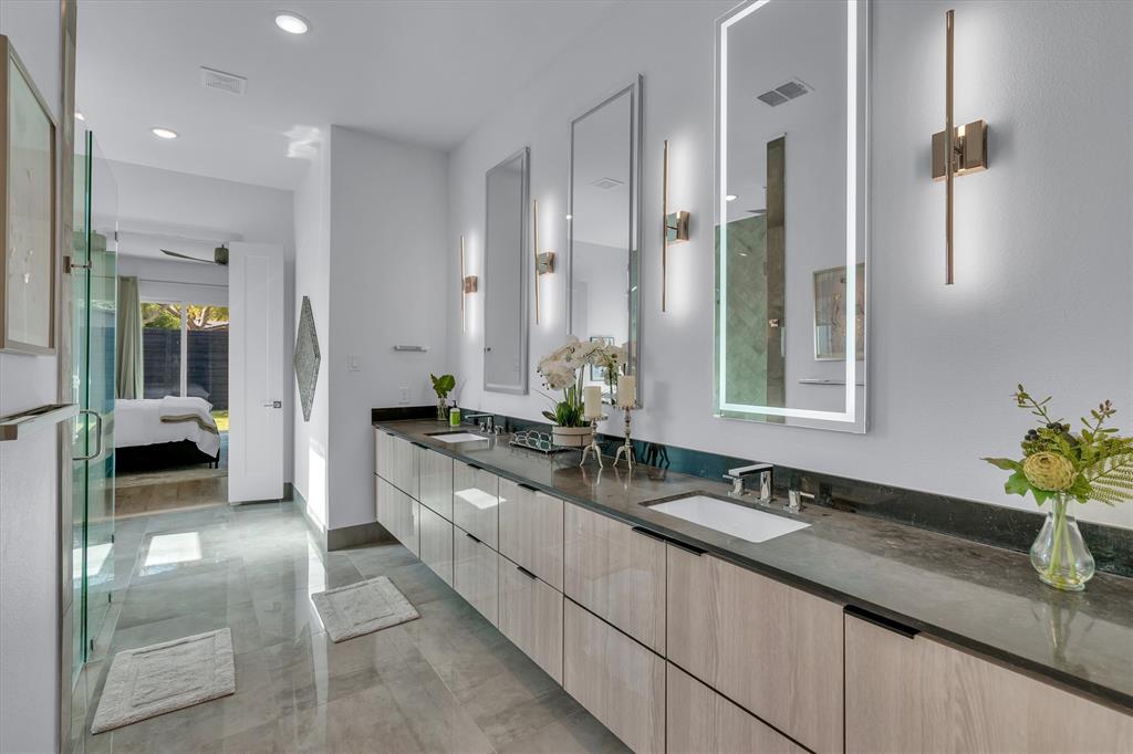 7519 Robin Road Dallas, TX 75209 - Photo 30 of 40 a spacious bathroom with a double vanity sink and a mirror