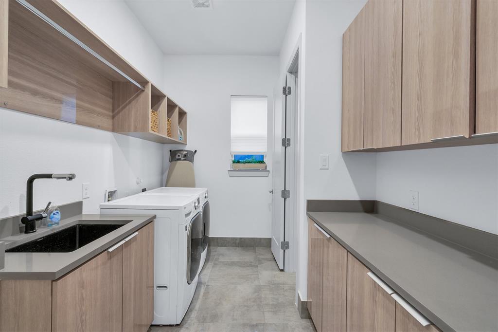 7519 Robin Road Dallas, TX 75209 - Photo 32 of 40 a kitchen with a sink stove and cabinets