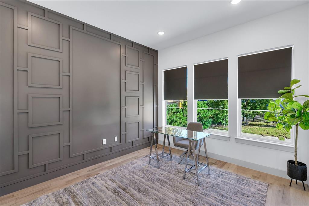 7519 Robin Road Dallas, TX 75209 - Photo 33 of 40 a workspace room with wooden floor and windows