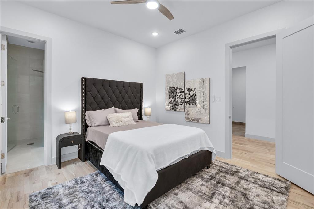 7519 Robin Road Dallas, TX 75209 - Photo 10 of 40 a bedroom with a bed and a mirror