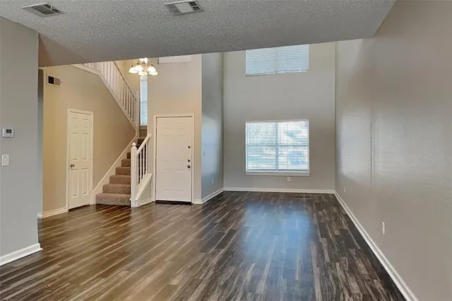 a view of an entryway with wooden floor