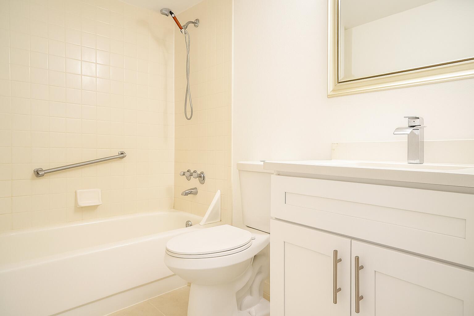 209 Foxtail Drive, Unit D2 Greenacres, FL 33415 - Photo 11 of 11 a bathroom with a toilet sink and shower