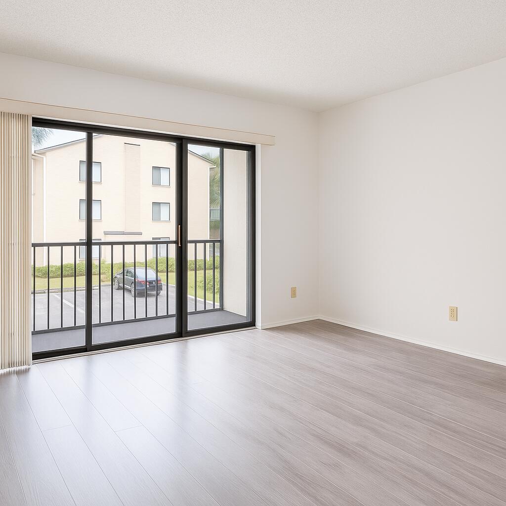 209 Foxtail Drive, Unit D2 Greenacres, FL 33415 - Photo 2 of 11 a view of a big room with wooden floor and windows
