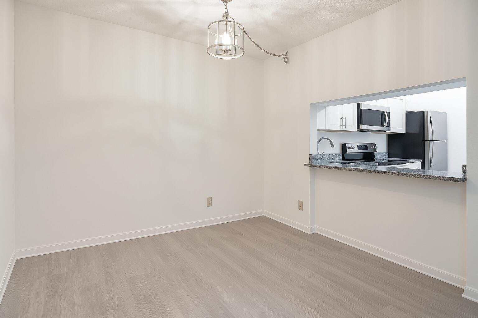 209 Foxtail Drive, Unit D2 Greenacres, FL 33415 - Photo 3 of 11 a view of a kitchen with a sink and dishwasher a microwave oven