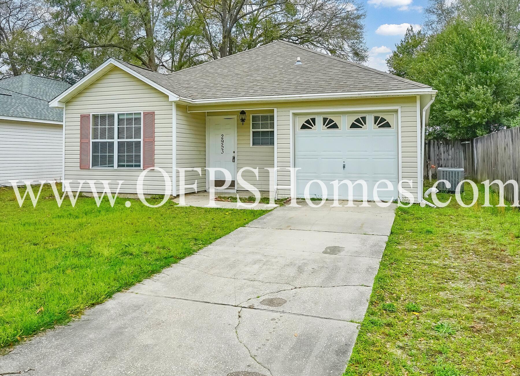 2953 Sholtz Avenue Crestview, FL 32539 - Photo 1 of 33 a front view of a house with garden and porch