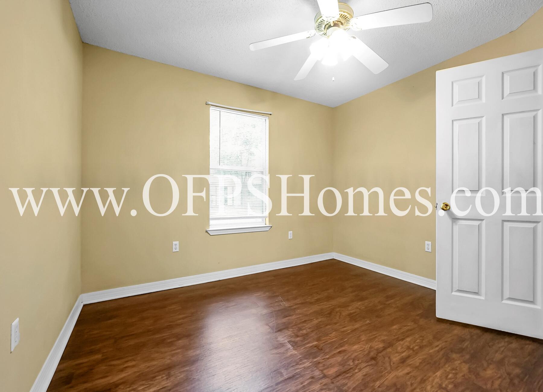 2953 Sholtz Avenue Crestview, FL 32539 - Photo 16 of 33 a view of a room with wooden floor