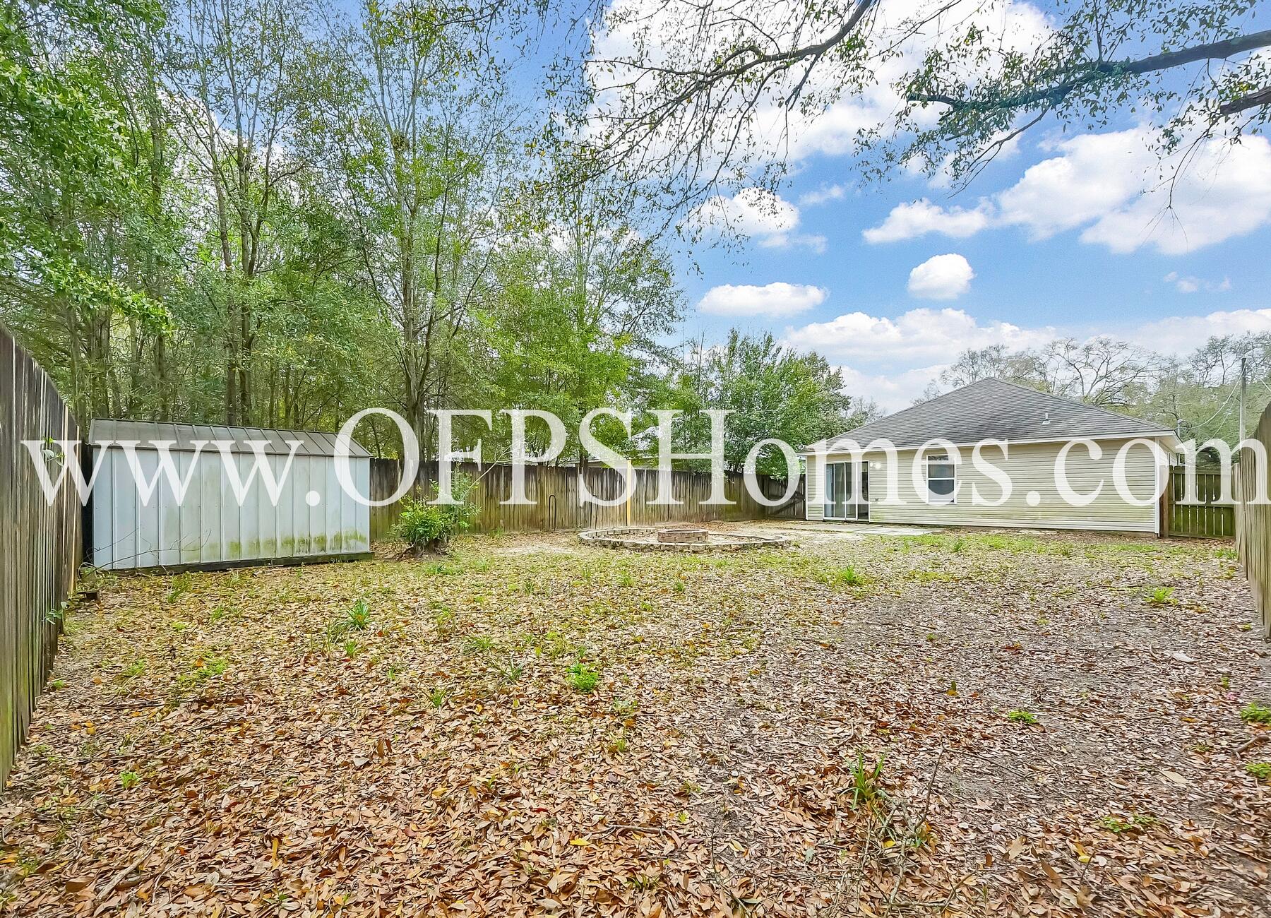 2953 Sholtz Avenue Crestview, FL 32539 - Photo 30 of 33 a front view of a house with garden