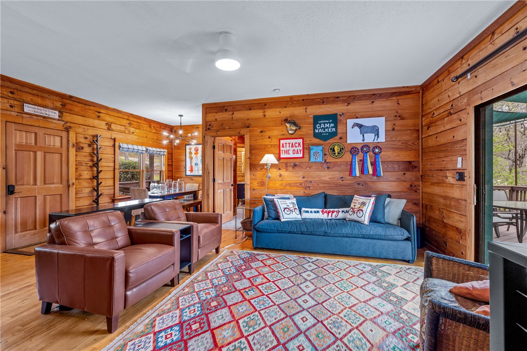 203 Little Lane Seneca, SC 29672 - Photo 16 of 48 This inviting space features warm wood-paneled walls and gleaming hardwood floors.