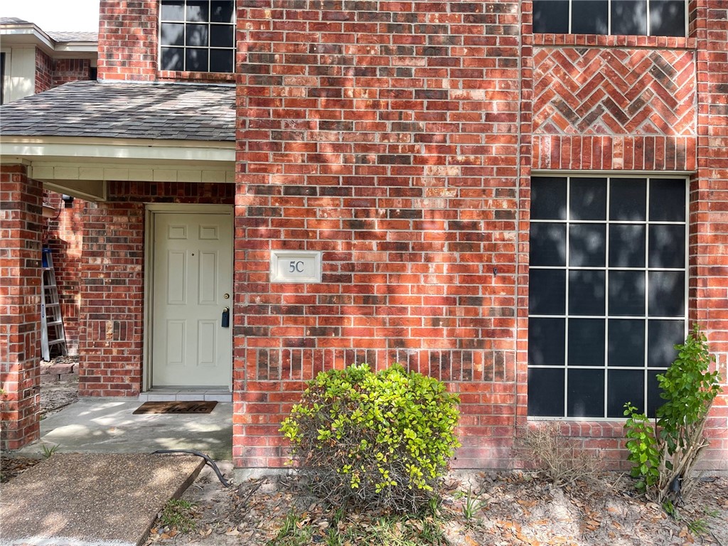 4022 Wood River Drive, Unit 5C Corpus Christi, TX 78410 - Photo 1 of 10 a front view of a building