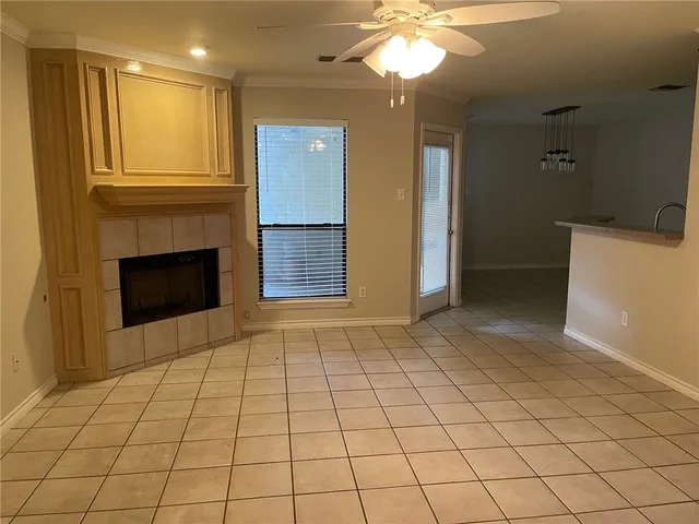 a view of an empty room with a fireplace