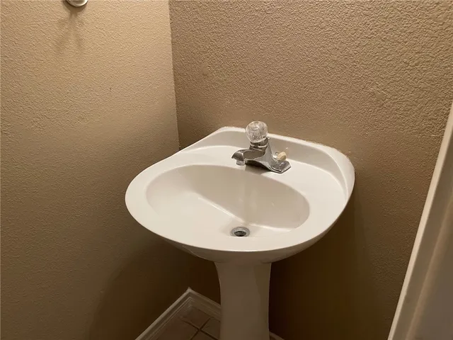 a bathroom with a sink and mirror