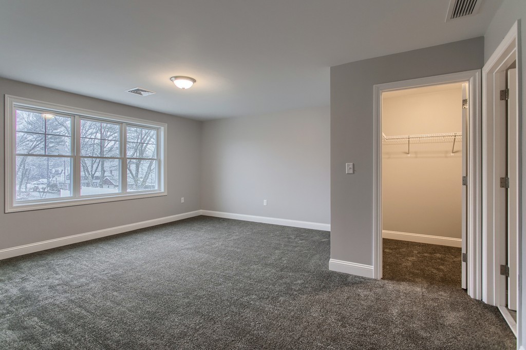 18 Jaclyn's Way, Unit 19 Billerica, MA 01821 - Photo 12 of 16 an empty room with windows