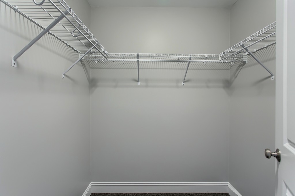 18 Jaclyn's Way, Unit 19 Billerica, MA 01821 - Photo 13 of 16 a view of a room with racks on the wall