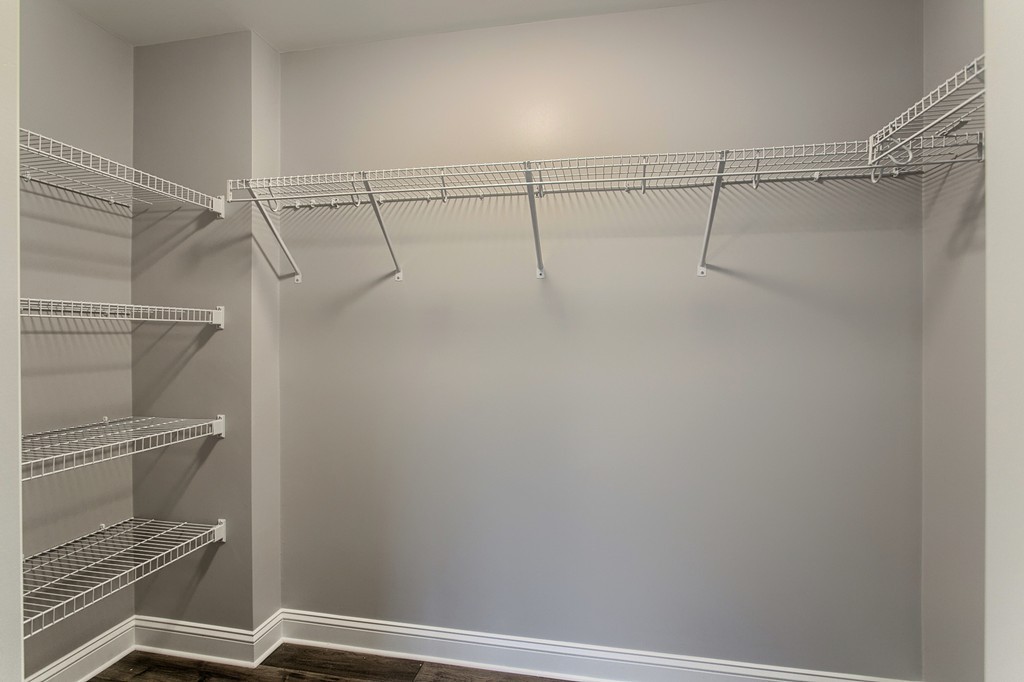 18 Jaclyn's Way, Unit 19 Billerica, MA 01821 - Photo 6 of 16 a view of a room with racks on the wall