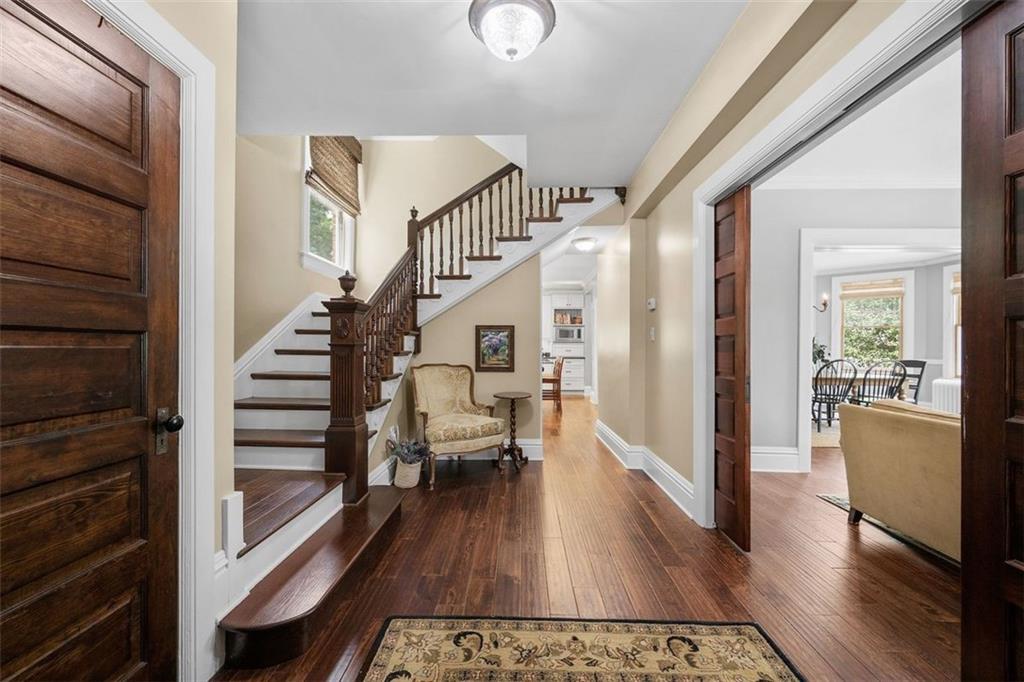209 Chestnut Road Sewickley, PA 15143 - Photo 17 of 49 a view of a hallway view with wooden floor and staircase