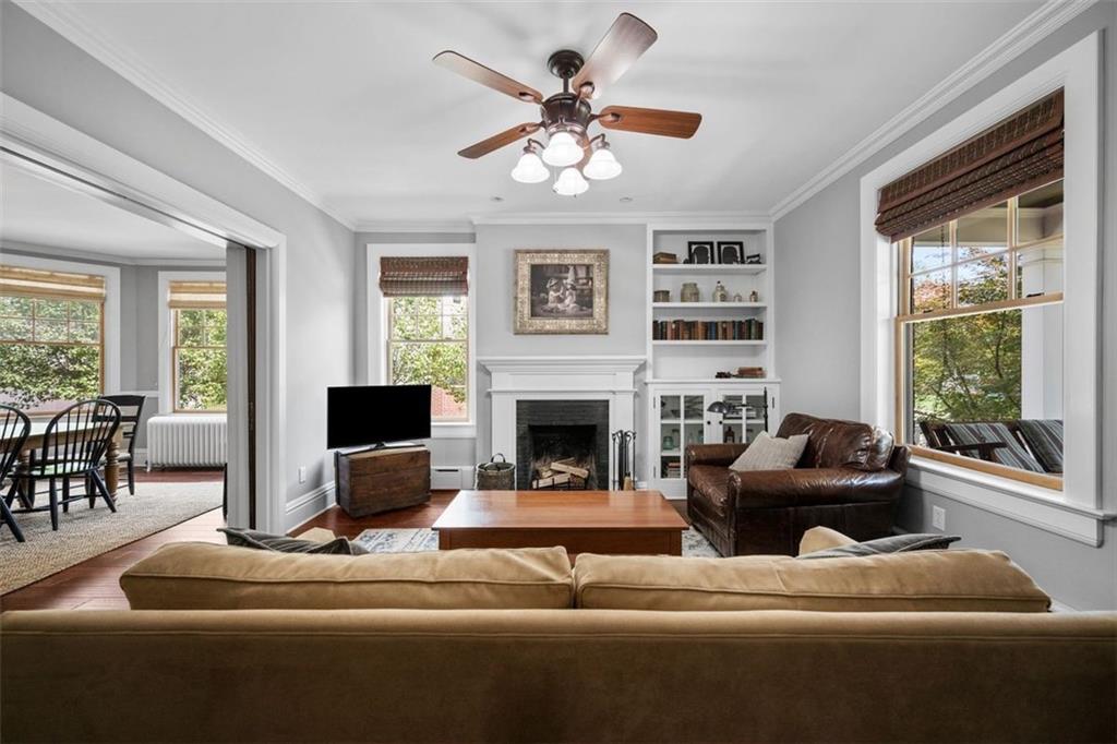 209 Chestnut Road Sewickley, PA 15143 - Photo 18 of 49 a living room with furniture a large window and a fireplace