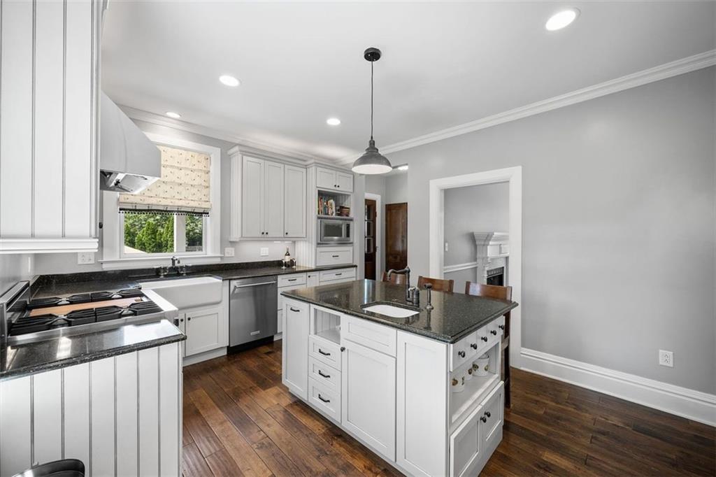 209 Chestnut Road Sewickley, PA 15143 - Photo 28 of 49 a kitchen that has a lot of cabinets in it and wooden floor