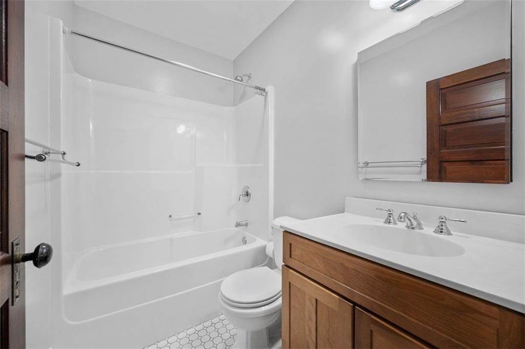 209 Chestnut Road Sewickley, PA 15143 - Photo 41 of 49 a bathroom with a sink a toilet and a bathtub
