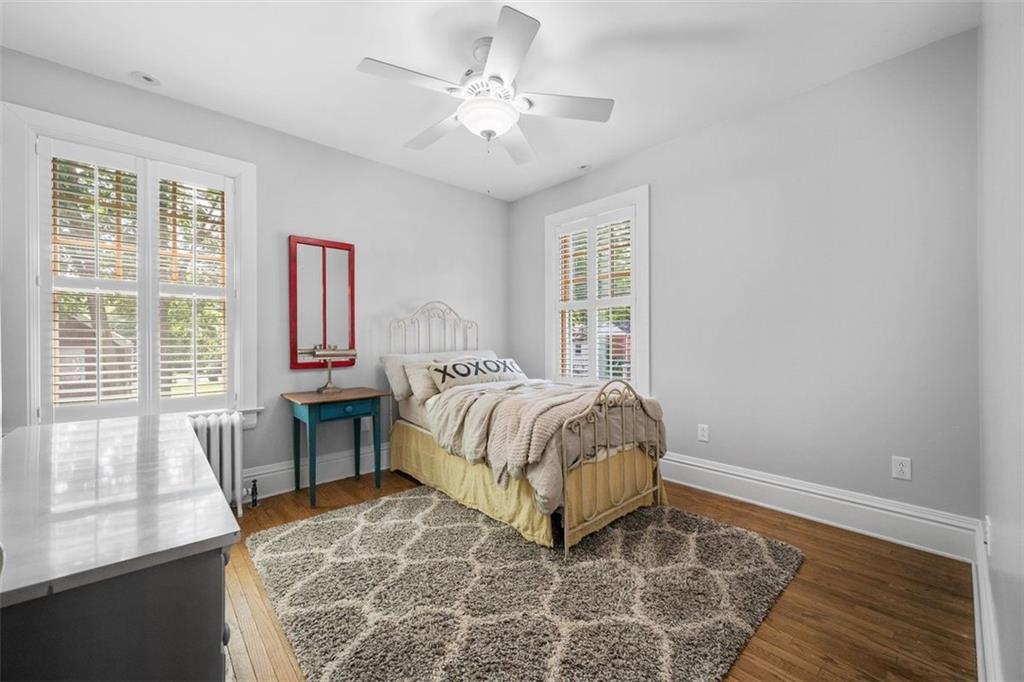 209 Chestnut Road Sewickley, PA 15143 - Photo 42 of 49 a bedroom with a bed and a window with chair