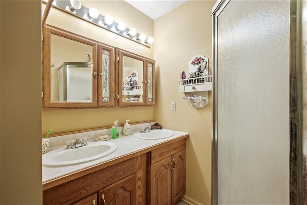 0 Grange Road Beaver Falls, PA 15010 - Photo 33 of 50 a bathroom with a double vanity sink and a mirror
