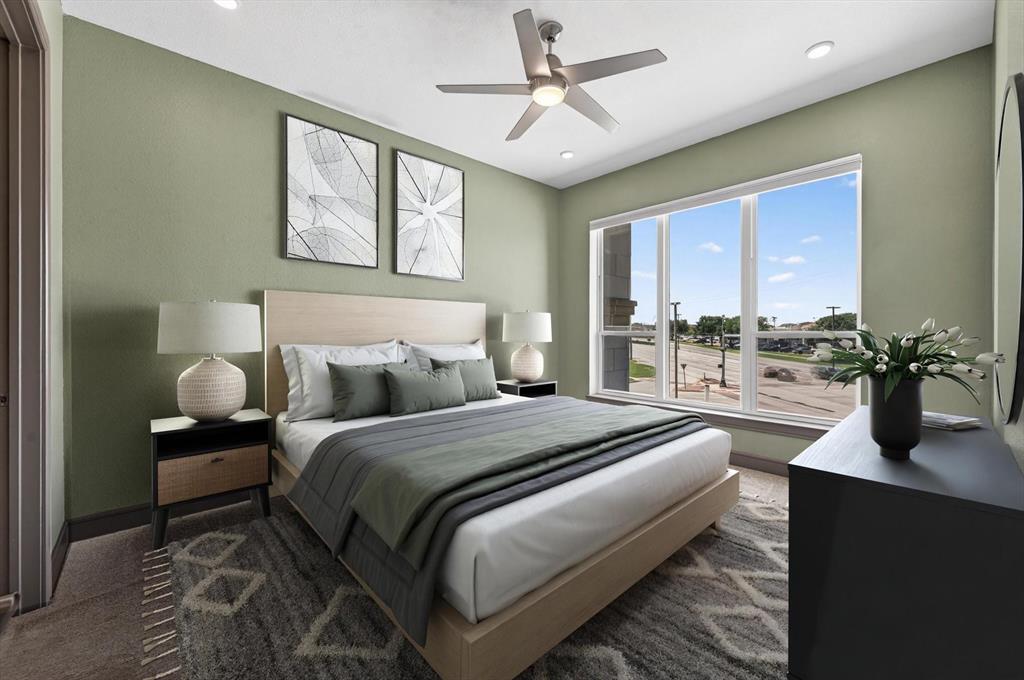 2700 Old Denton Road, Unit 2259 Carrollton, TX 75007 - Photo 7 of 39 a bedroom with a bed and a large window