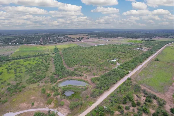 a view of a lake with a big yard