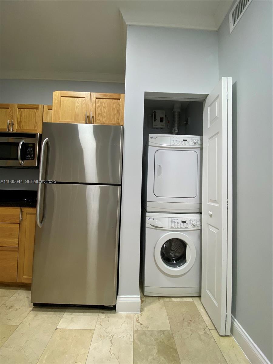 1750 Northwest 107th Avenue, Unit R509 Sweetwater, FL 33172 - Photo 11 of 23 a utility room with dryer and washer