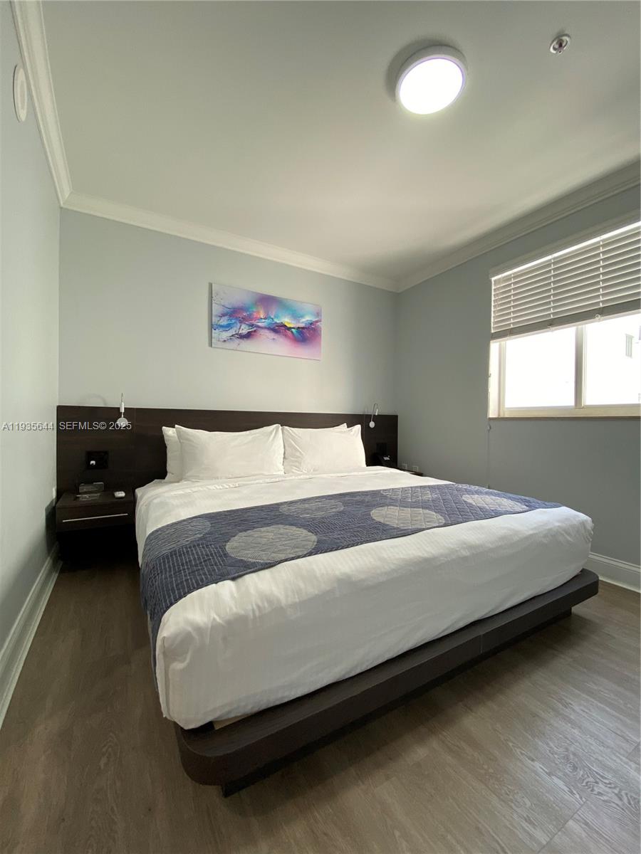 1750 Northwest 107th Avenue, Unit R509 Sweetwater, FL 33172 - Photo 15 of 23 a bedroom with a bed and a couch