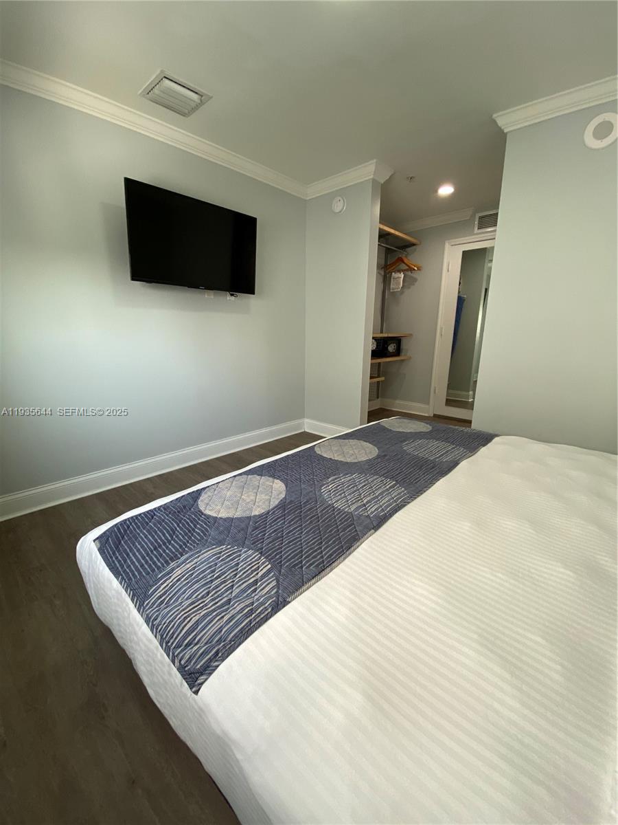 1750 Northwest 107th Avenue, Unit R509 Sweetwater, FL 33172 - Photo 16 of 23 a view of a livingroom with a flat screen tv