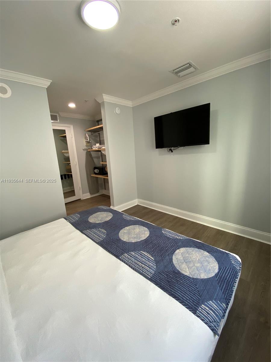 1750 Northwest 107th Avenue, Unit R509 Sweetwater, FL 33172 - Photo 23 of 23 a bedroom with a bed and a television