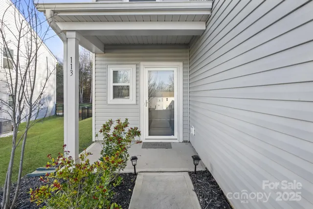 a view of a pathway besides a house
