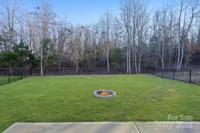 a view of a backyard with a trampoline