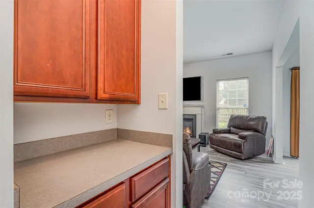 a kitchen with a refrigerator and a sink